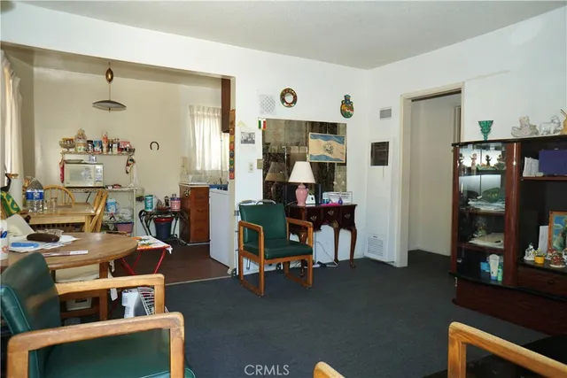 a view of a livingroom with furniture and a window