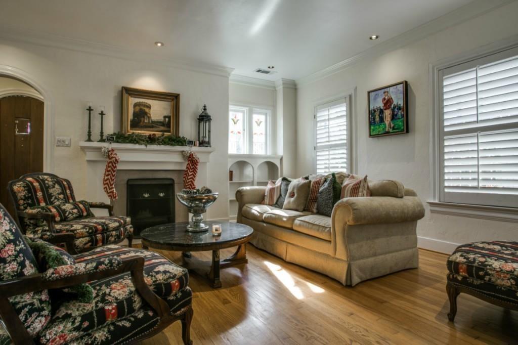 5419 Merrimac Avenue Dallas, TX 75206 - Photo 15 of 17 Living area featuring wood-finish flooring and multiple windows with plantation shutters