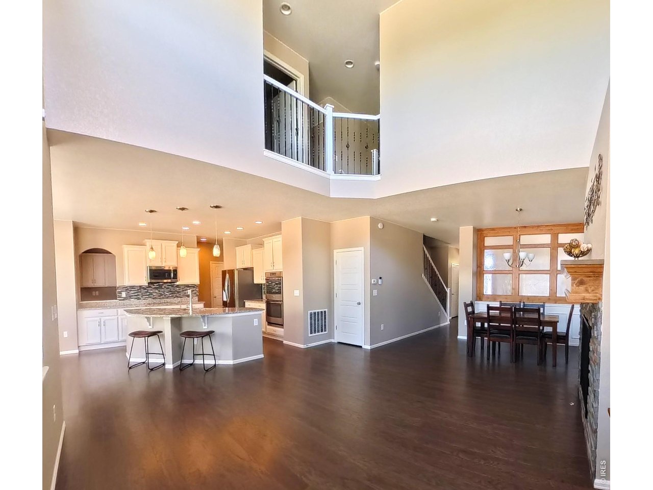 10434 Bluegrass Street Firestone, CO 80504 - Photo 7 of 26 2 story open living room ceiling