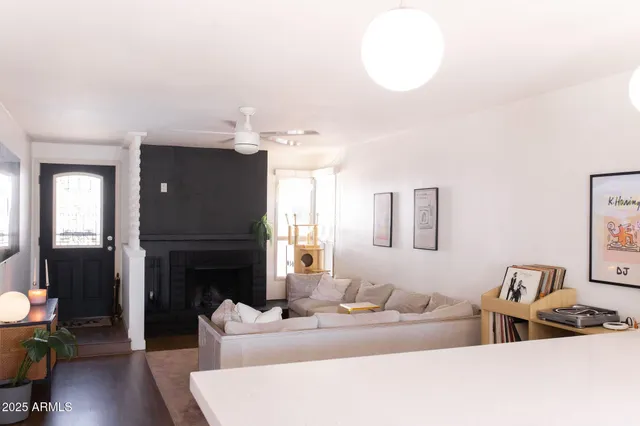 a living room with furniture and a fireplace