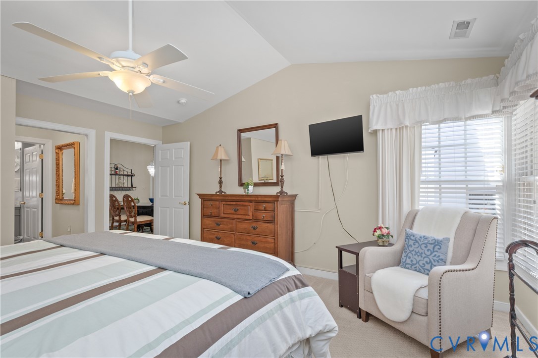2205 Magnolia Grove Way Midlothian, VA 23113 - Photo 21 of 37 a bedroom with a bed and a flat screen tv