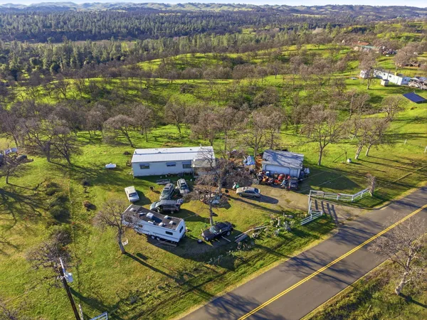 an aerial view of a house with a swimming pool