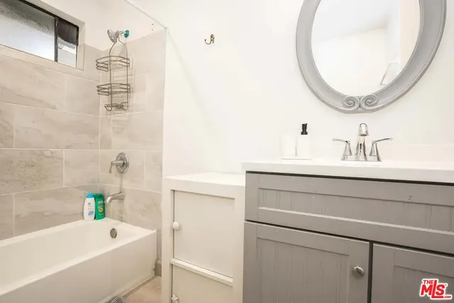 a bathroom with a bathtub and a sink