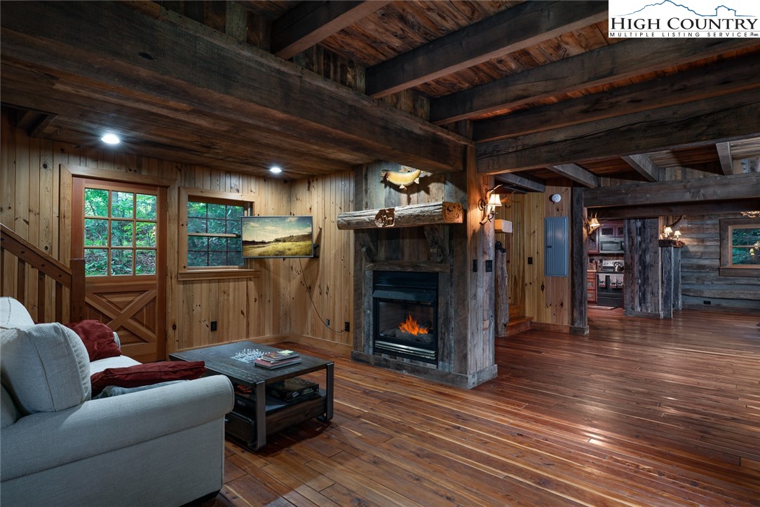 164 Avery Co High School Road, Unit LOG #2 Newland, NC 28657 - Photo 6 of 24 a living room with furniture and a fireplace