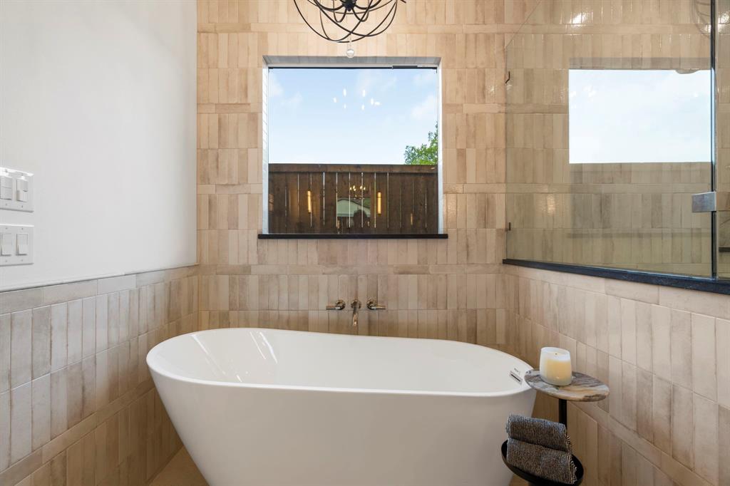 3316 Ferguson Road Grapevine, TX 76092 - Photo 17 of 39 a white bath tub sitting in a bathroom