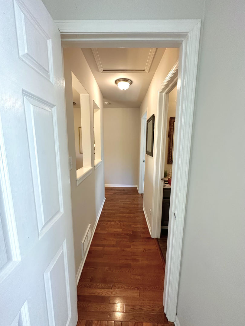 26668 Highway 83 Mundelein, IL 60060 - Photo 20 of 41 a view of a hallway with wooden floor and staircase