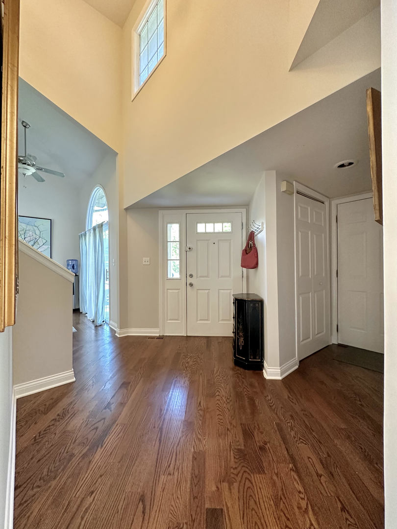 26668 Highway 83 Mundelein, IL 60060 - Photo 2 of 41 a view of a livingroom with wooden floor and furniture