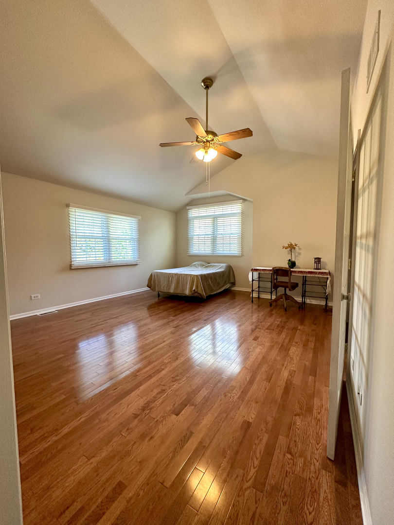 26668 Highway 83 Mundelein, IL 60060 - Photo 23 of 41 a view of a livingroom with furniture a ceiling fan and window