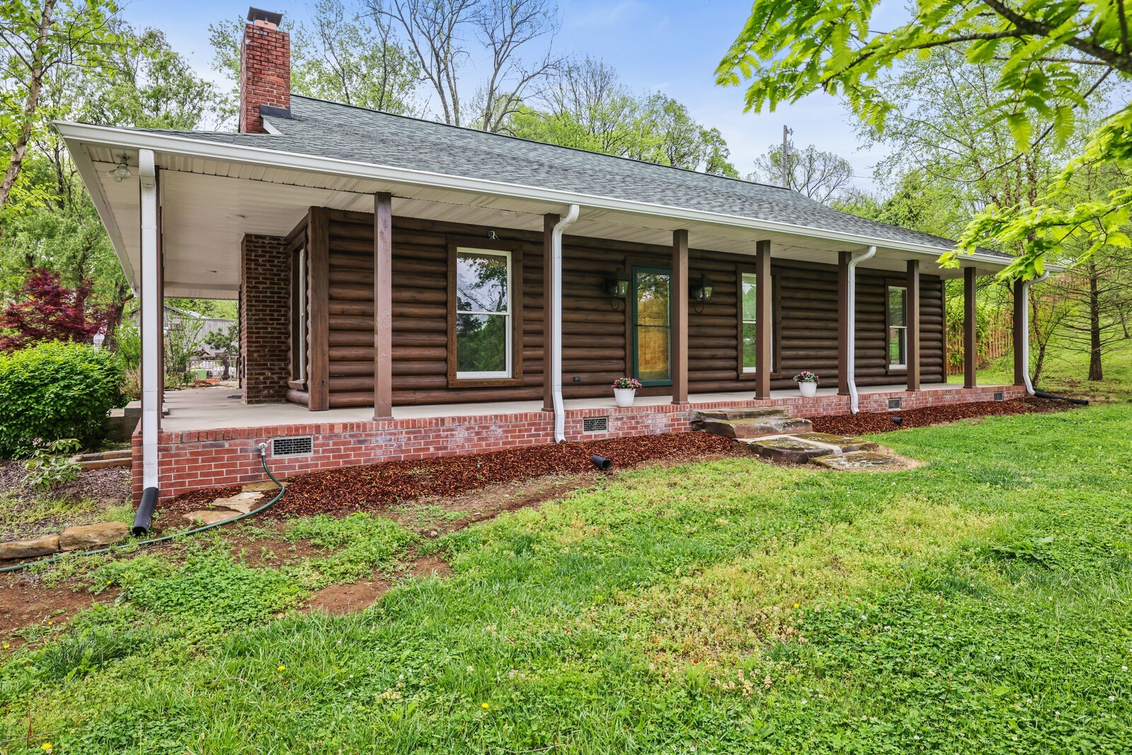 5700 Cane Ridge Road Antioch, TN 37013 - Photo 1 of 61 front view of a house with a yard and a table