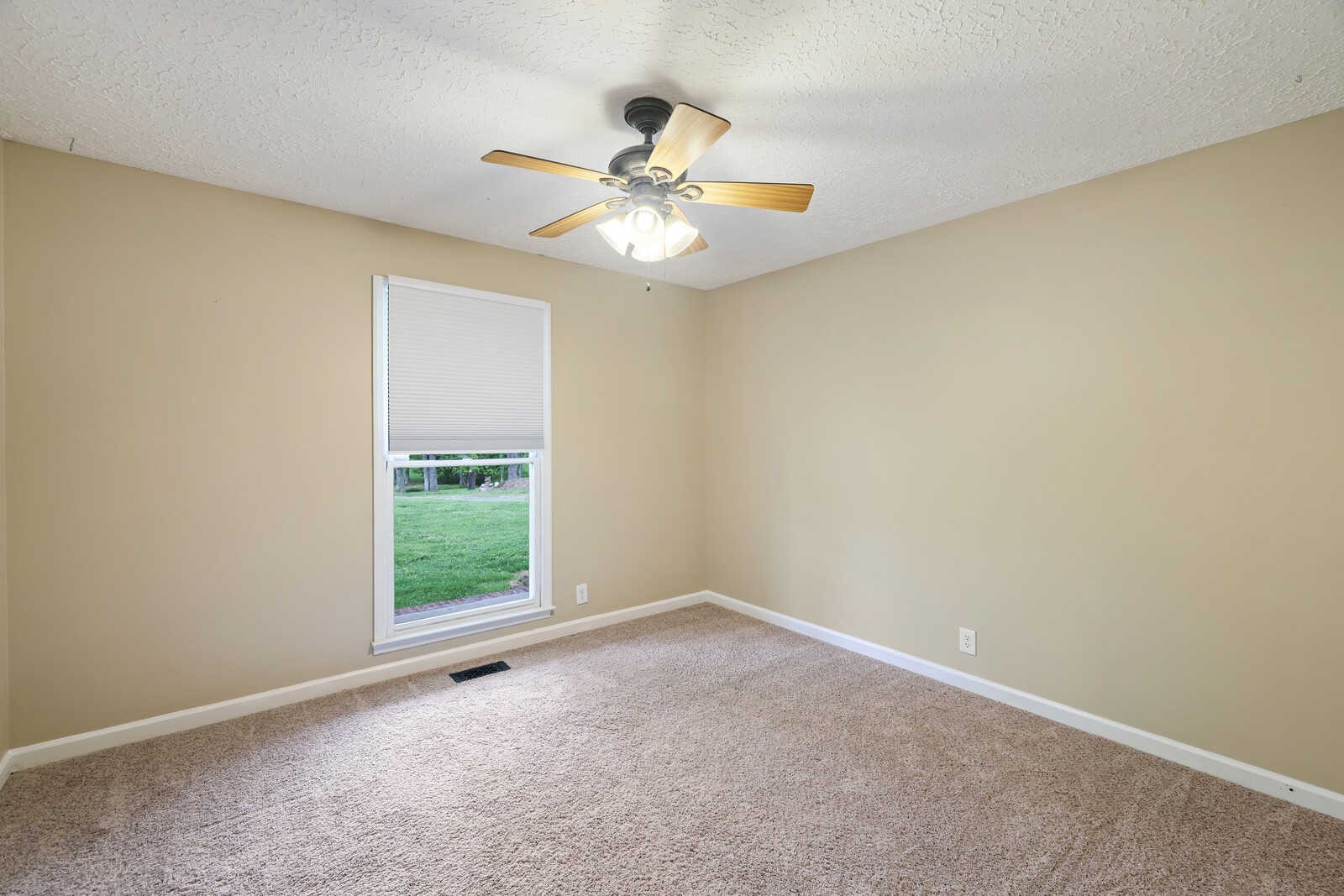 5700 Cane Ridge Road Antioch, TN 37013 - Photo 13 of 61 an empty room with a window and a fan