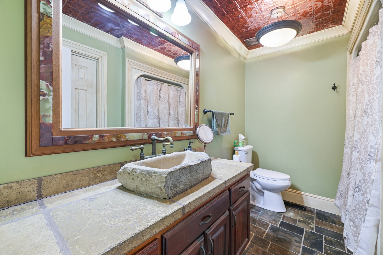 5700 Cane Ridge Road Antioch, TN 37013 - Photo 22 of 61 a bathroom with a granite countertop toilet sink and mirror
