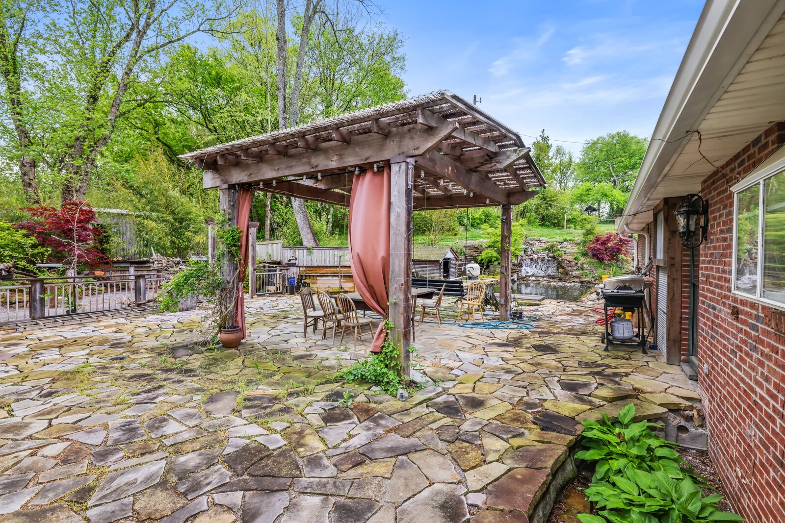 5700 Cane Ridge Road Antioch, TN 37013 - Photo 30 of 61 a view of a patio with a table chairs and a backyard