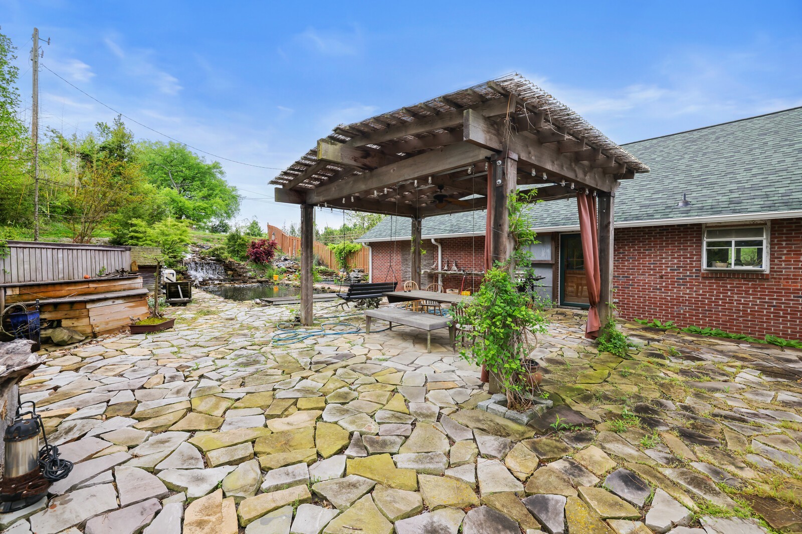 5700 Cane Ridge Road Antioch, TN 37013 - Photo 34 of 61 a view of a patio with table and chairs under an umbrella