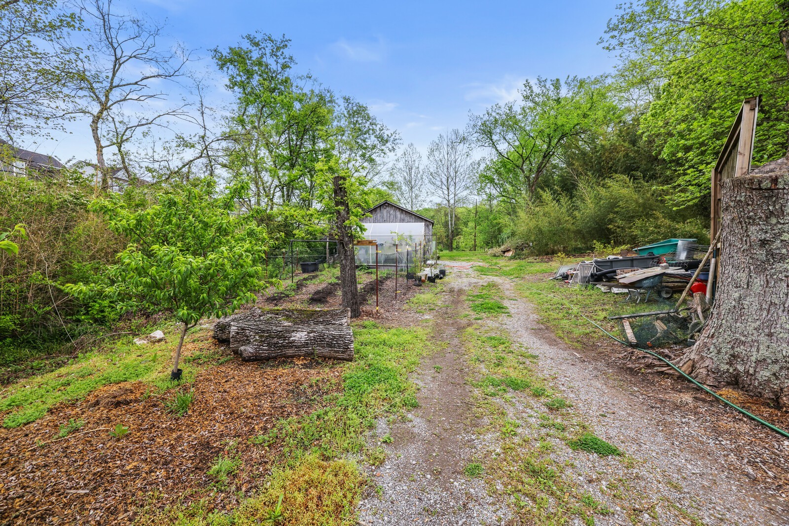 5700 Cane Ridge Road Antioch, TN 37013 - Photo 37 of 61 a backyard of a house with a garden and outdoor seating