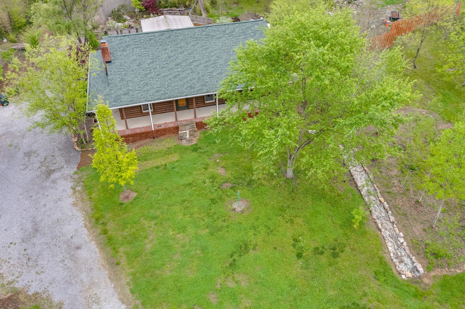 5700 Cane Ridge Road Antioch, TN 37013 - Photo 57 of 61 a backyard of a house with plants and large trees