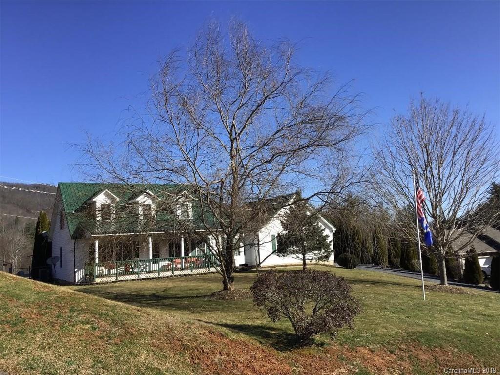 64 Squaw Ridge Road Waynesville, NC 28786 - Photo 3 of 32 a view of a house with a yard