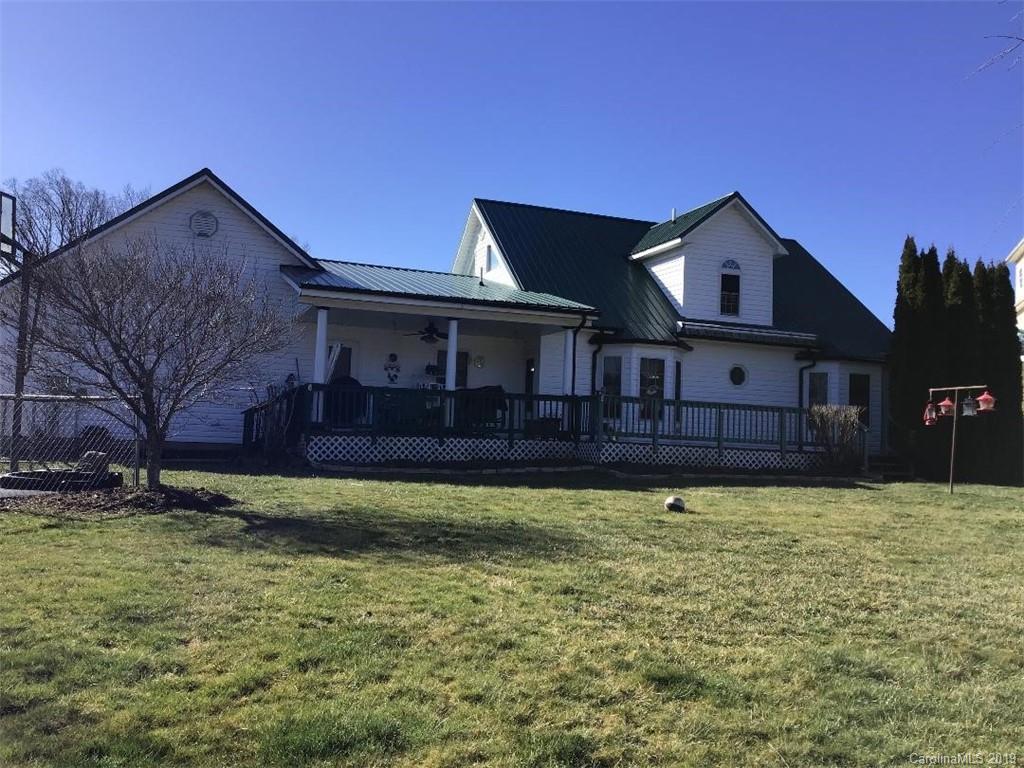 64 Squaw Ridge Road Waynesville, NC 28786 - Photo 29 of 32 a front view of a house with a yard