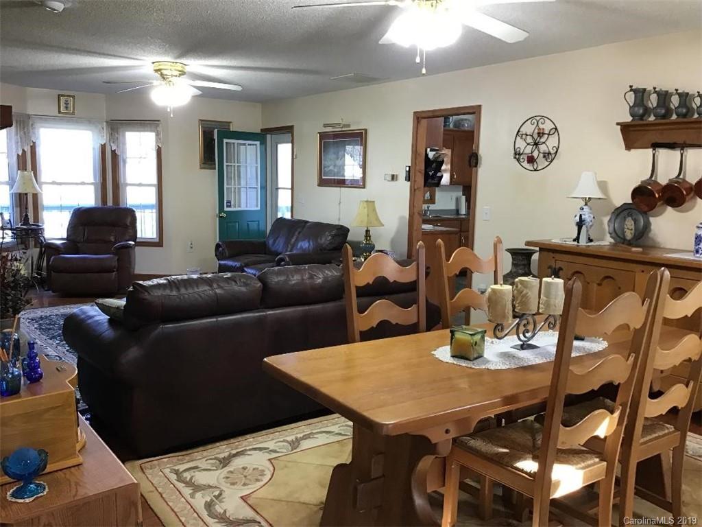 64 Squaw Ridge Road Waynesville, NC 28786 - Photo 5 of 32 a view of a dining room with furniture