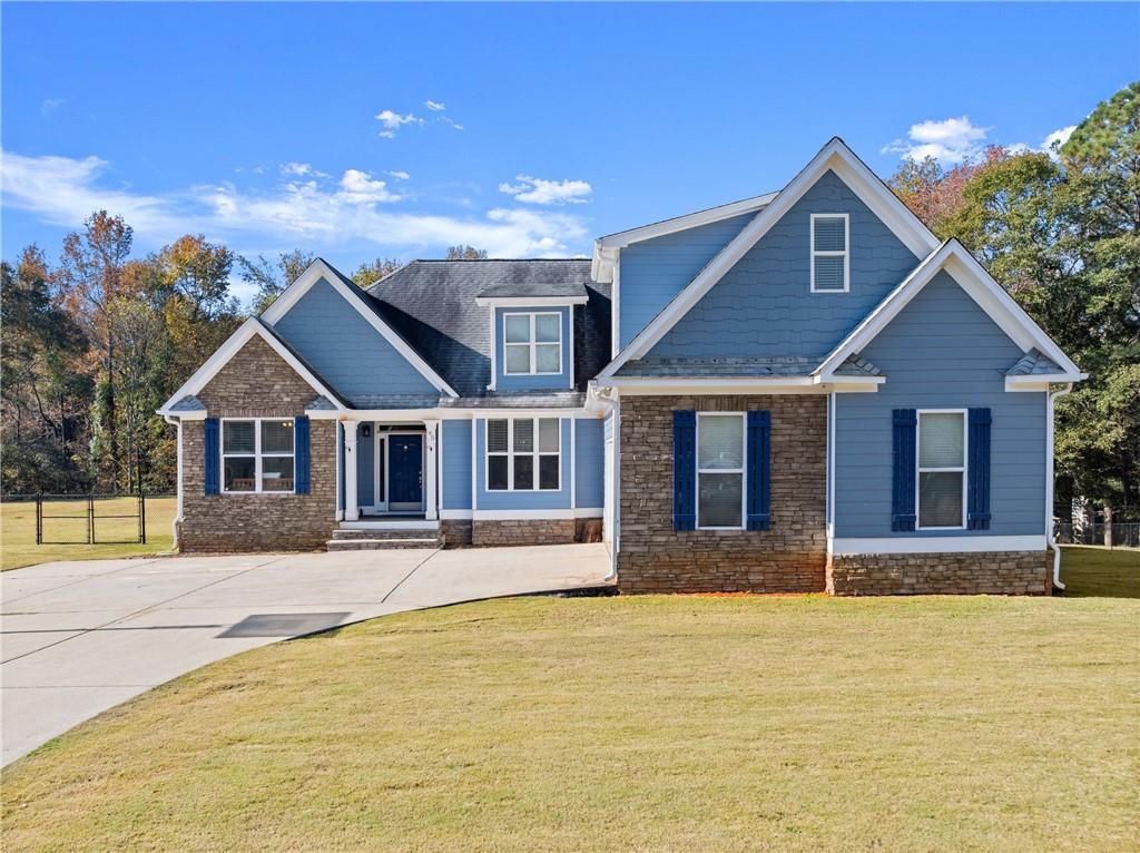 a front view of a house with a yard