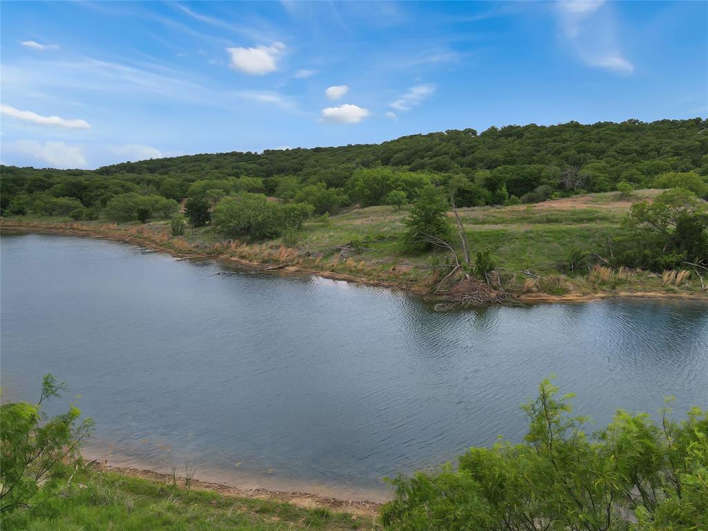 Tbd Tbd Tenbears Court Mingus, TX 76463 - Photo 16 of 20 a view of a lake with houses in the back
