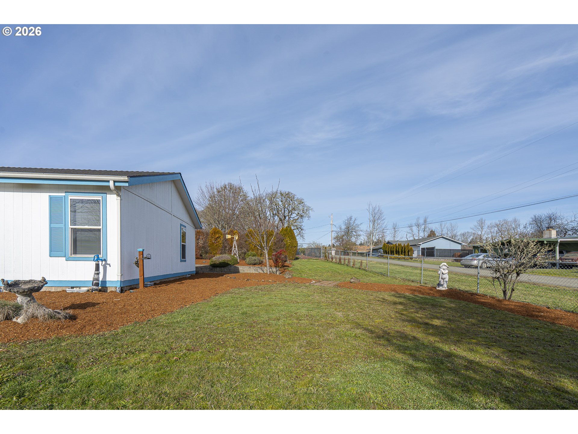 860 West Ellendale Avenue Dallas, OR 97338 - Photo 13 of 33 a view of a house with a yard and a large tree