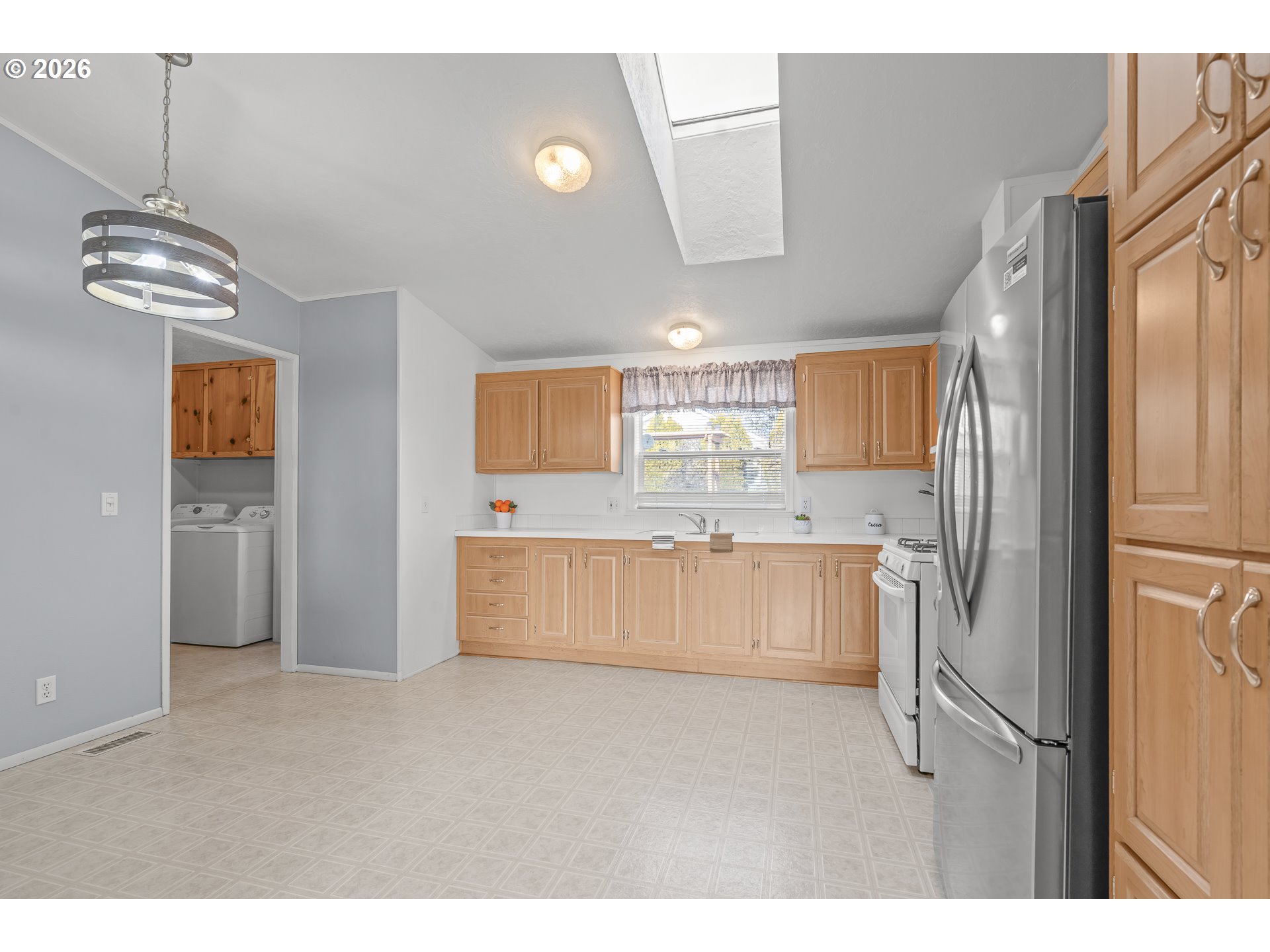 860 West Ellendale Avenue Dallas, OR 97338 - Photo 18 of 33 a kitchen with stainless steel appliances a refrigerator sink and stove