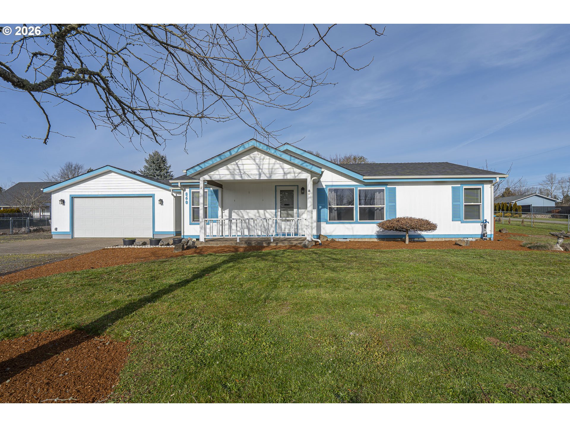 860 West Ellendale Avenue Dallas, OR 97338 - Photo 2 of 33 a front view of a house with a garden
