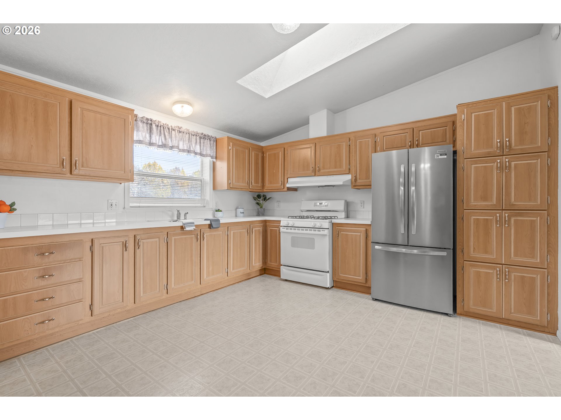 860 West Ellendale Avenue Dallas, OR 97338 - Photo 21 of 33 a kitchen with stainless steel appliances granite countertop a refrigerator sink and cabinets