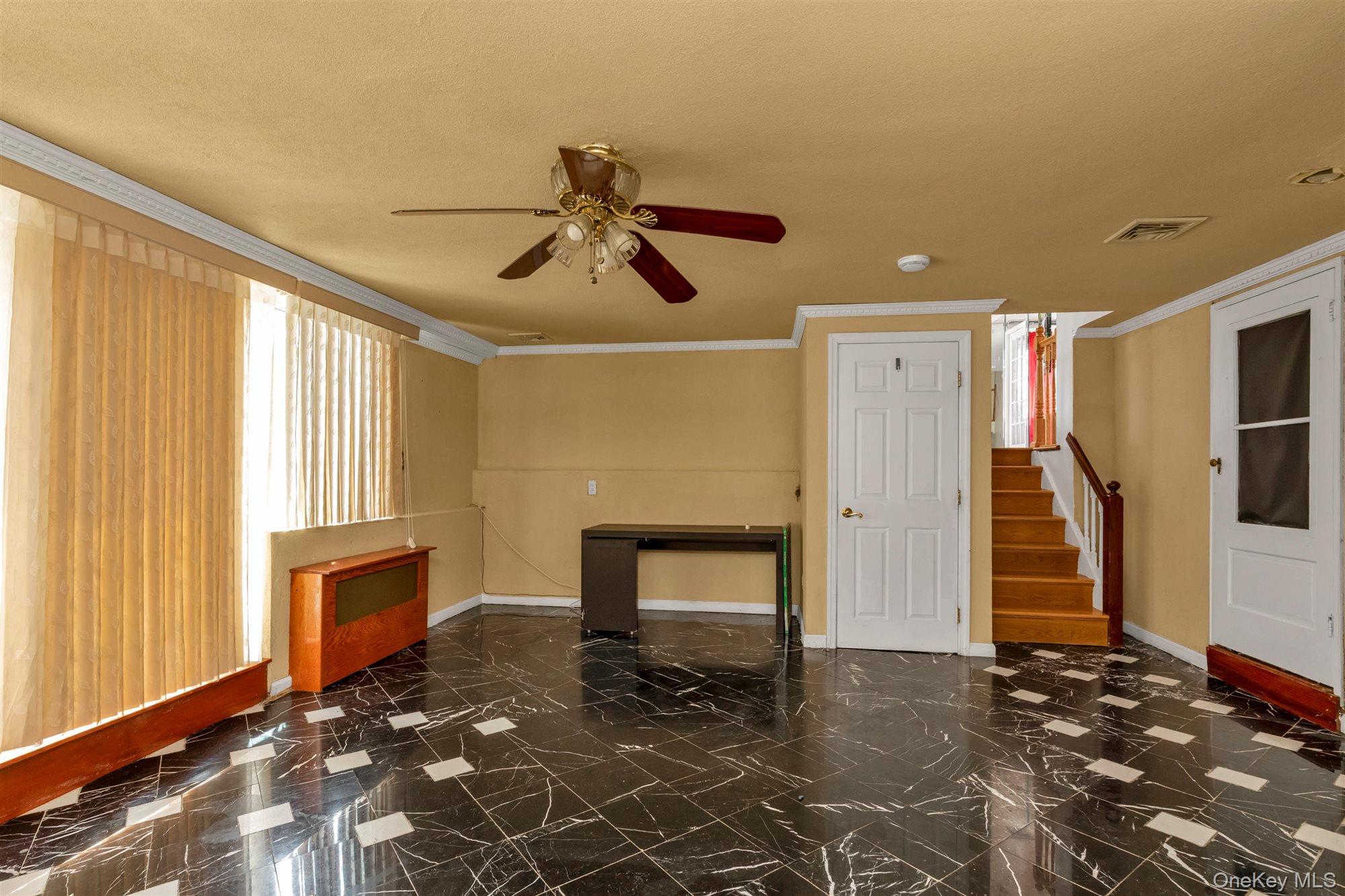 830 Pepperidge Road Westbury, NY 11590 - Photo 11 of 23 a bedroom with a bed and a window