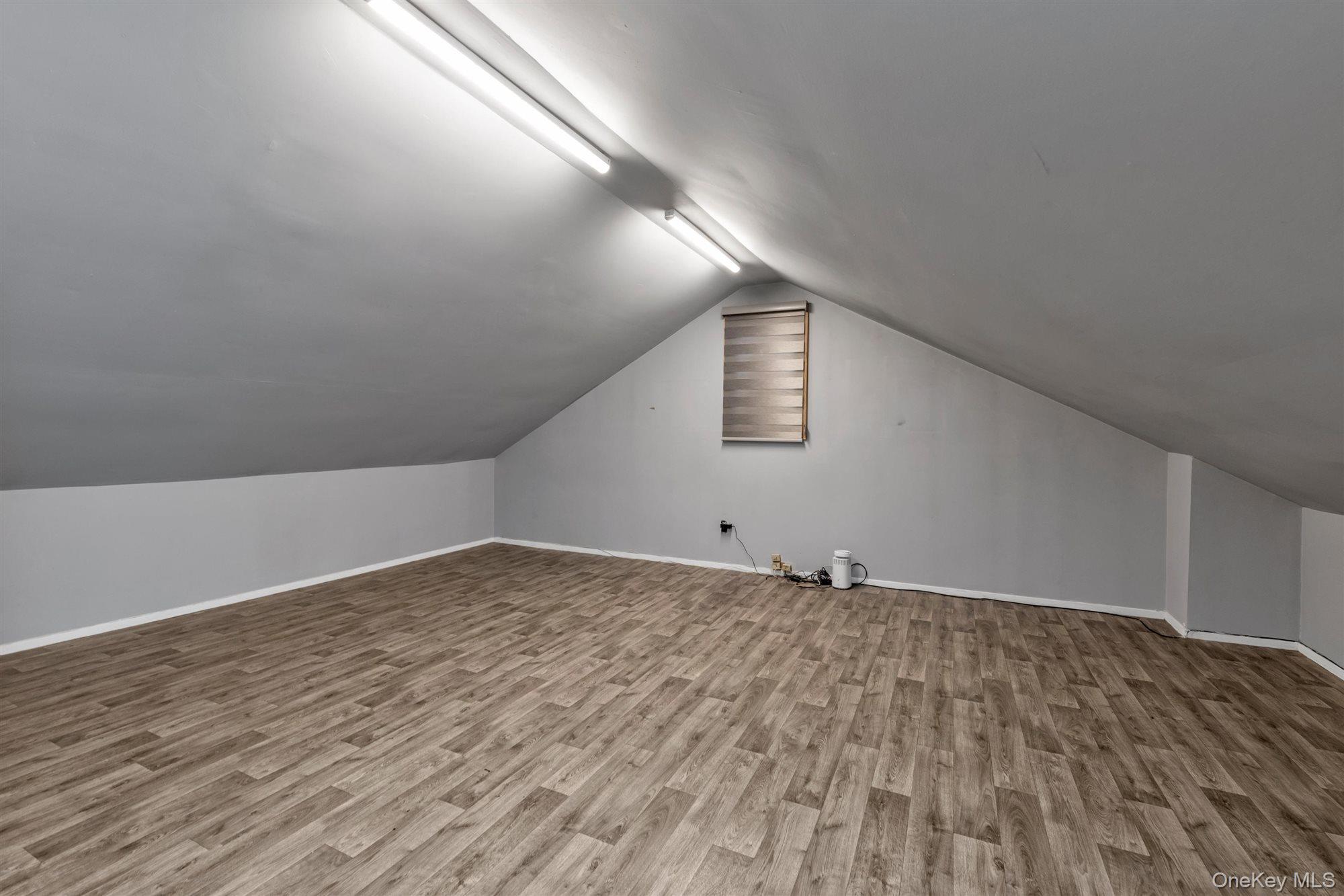 830 Pepperidge Road Westbury, NY 11590 - Photo 20 of 23 a view of an empty room and window