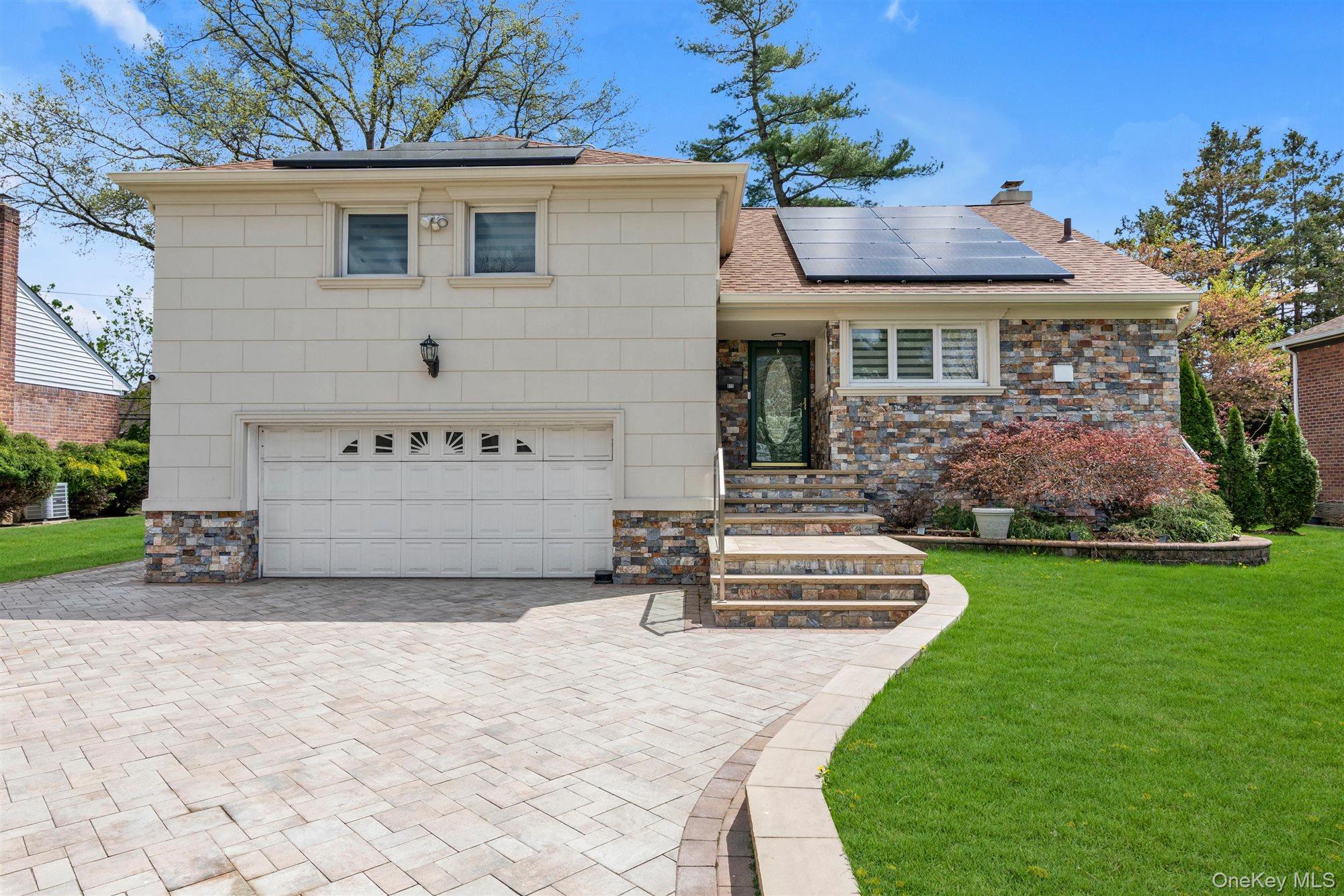 830 Pepperidge Road Westbury, NY 11590 - Photo 2 of 23 a front view of a house with garden