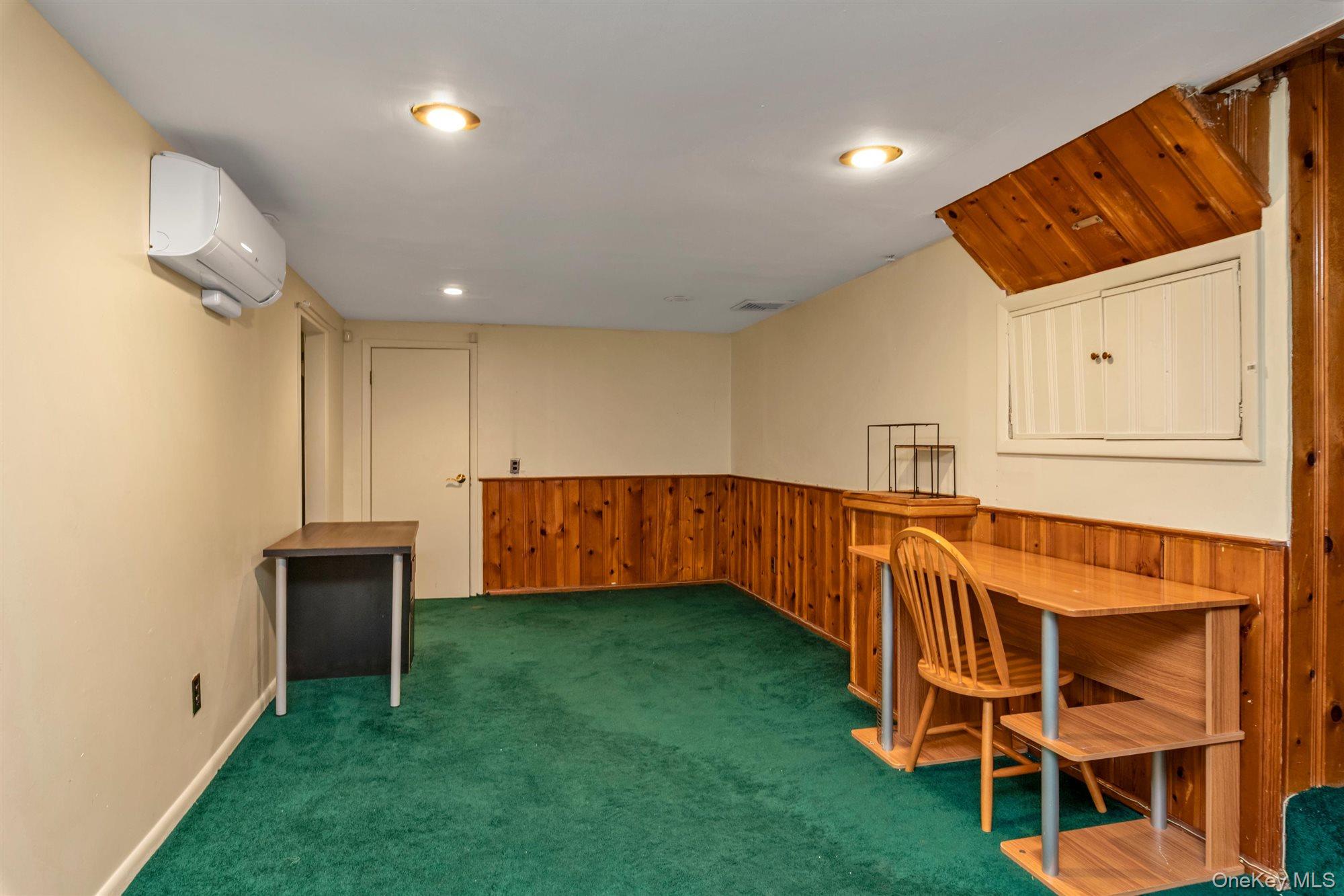830 Pepperidge Road Westbury, NY 11590 - Photo 21 of 23 a view of an empty room with wooden floor and windows