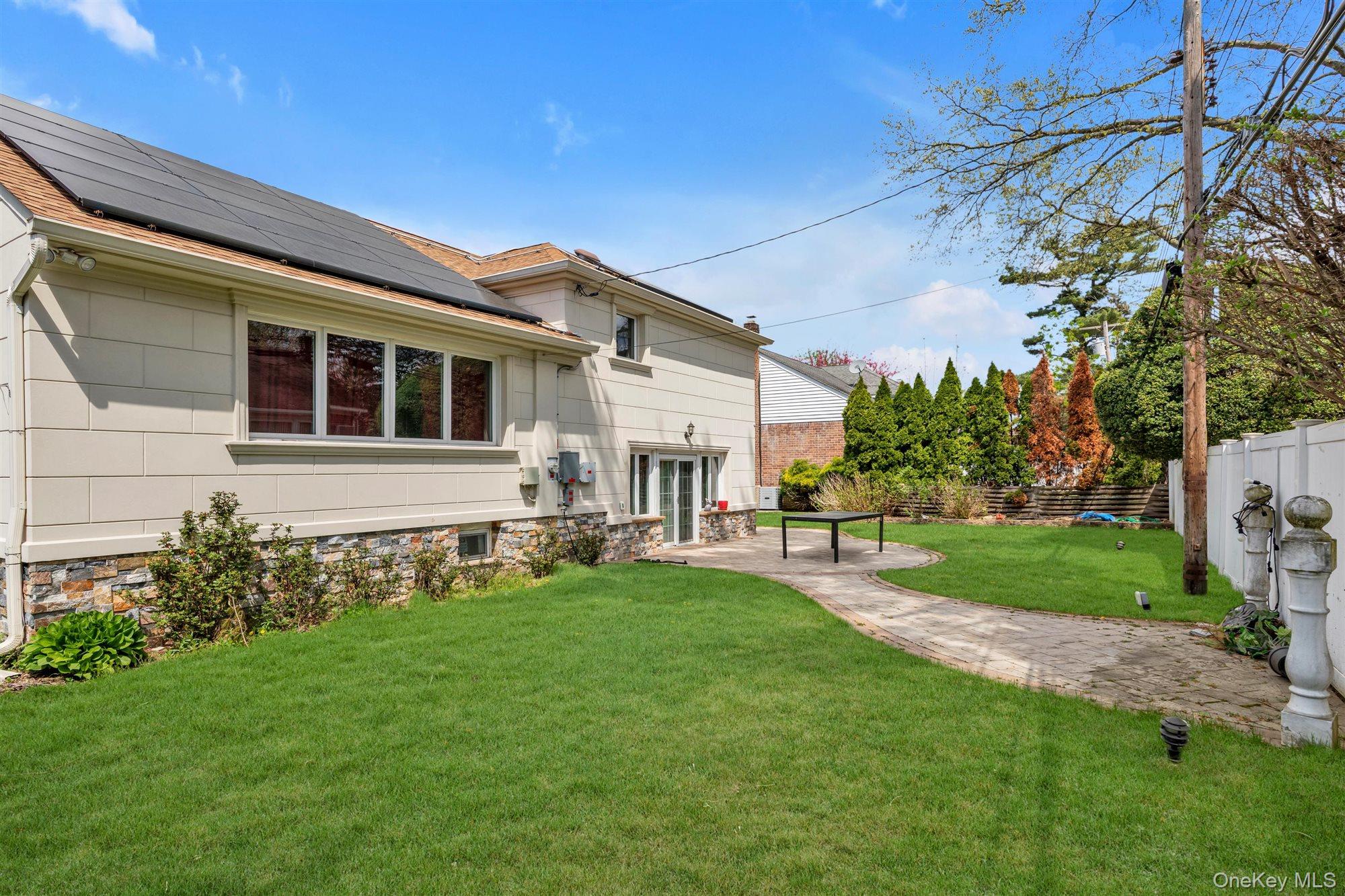 830 Pepperidge Road Westbury, NY 11590 - Photo 4 of 23 a front view of house with yard