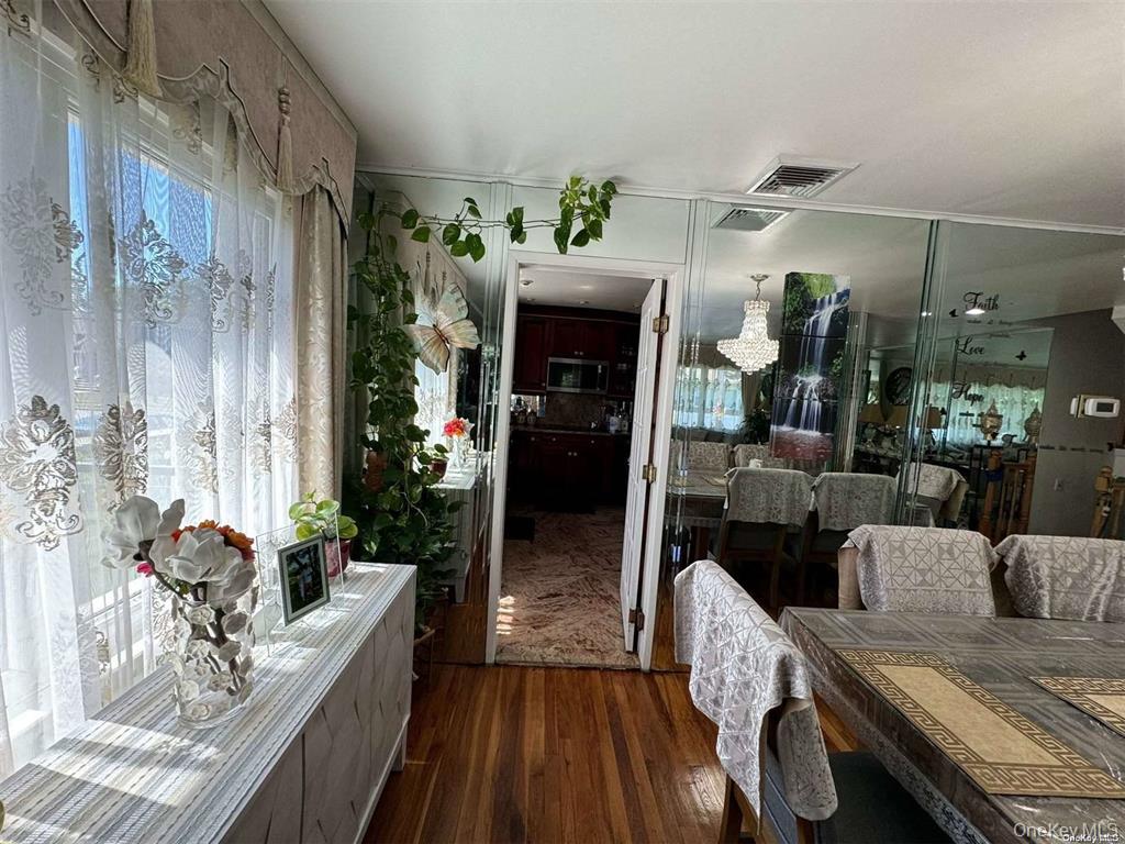 830 Pepperidge Road Westbury, NY 11590 - Photo 4 of 15 a view of a dining room with furniture window and outside view