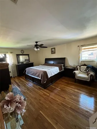 a bedroom with two beds and a couch