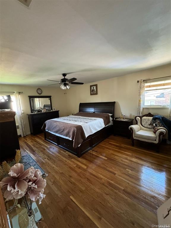 830 Pepperidge Road Westbury, NY 11590 - Photo 5 of 15 a bedroom with two beds and a couch