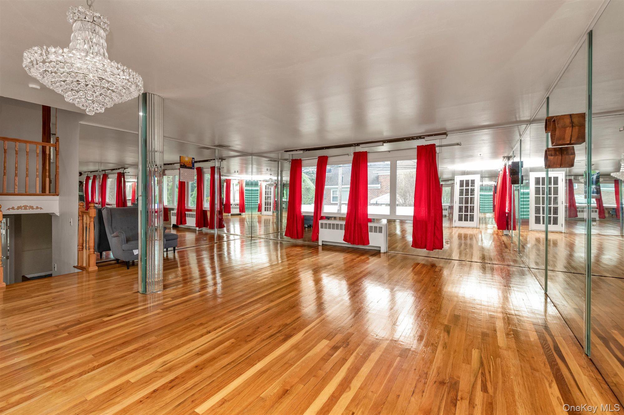830 Pepperidge Road Westbury, NY 11590 - Photo 6 of 23 a view of empty room with wooden floor and fan