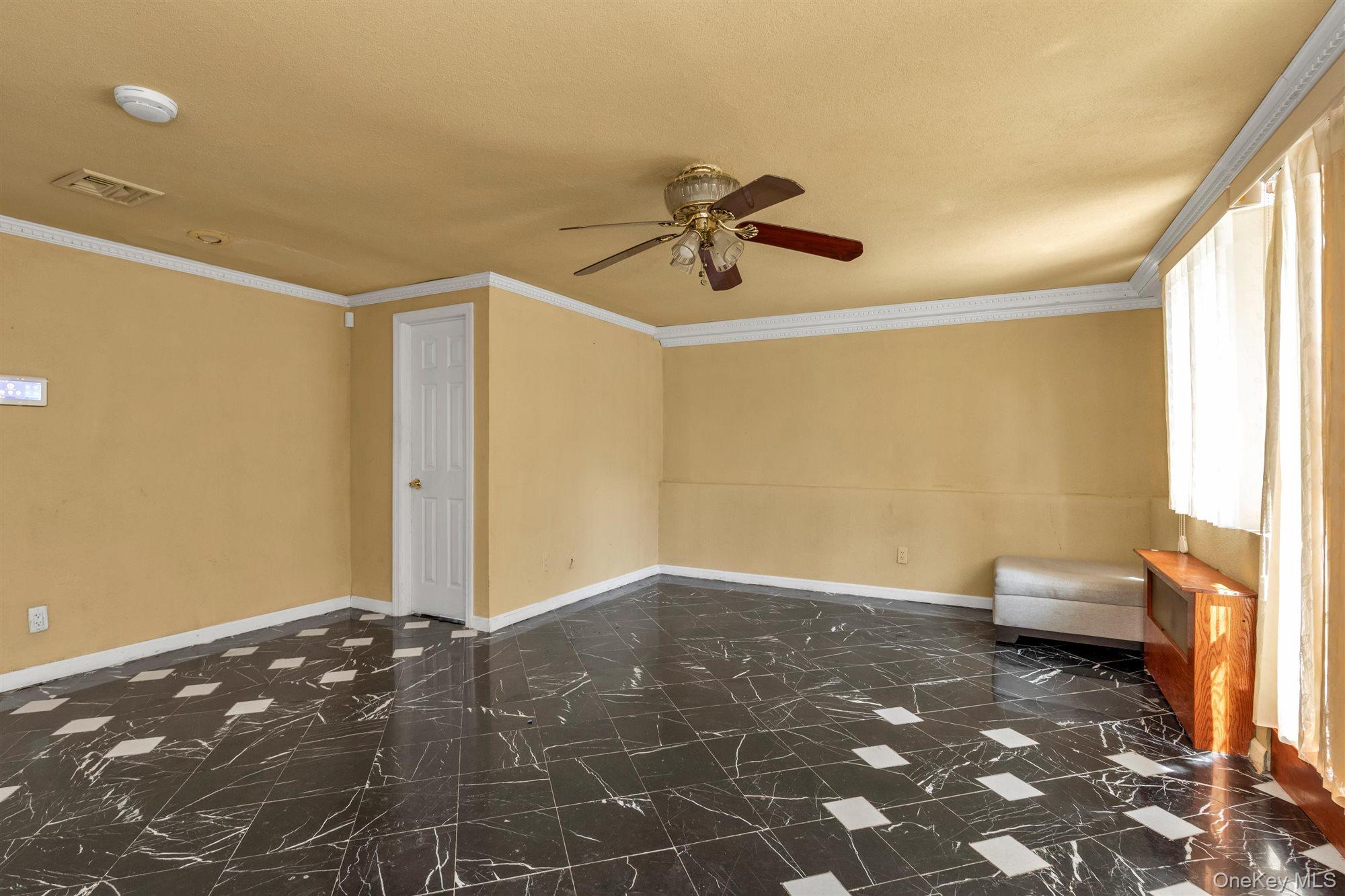830 Pepperidge Road Westbury, NY 11590 - Photo 10 of 23 a bedroom with a bed and a window