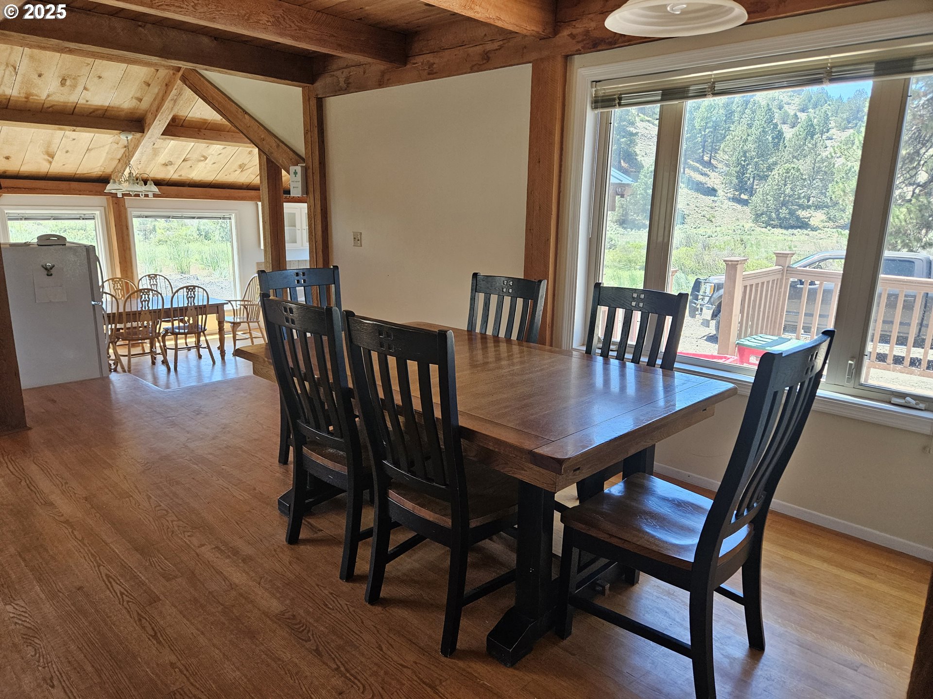 12142 Burns-Izee Road Seneca, OR 97873 - Photo 35 of 40 a view of a dining room with furniture window and wooden floor