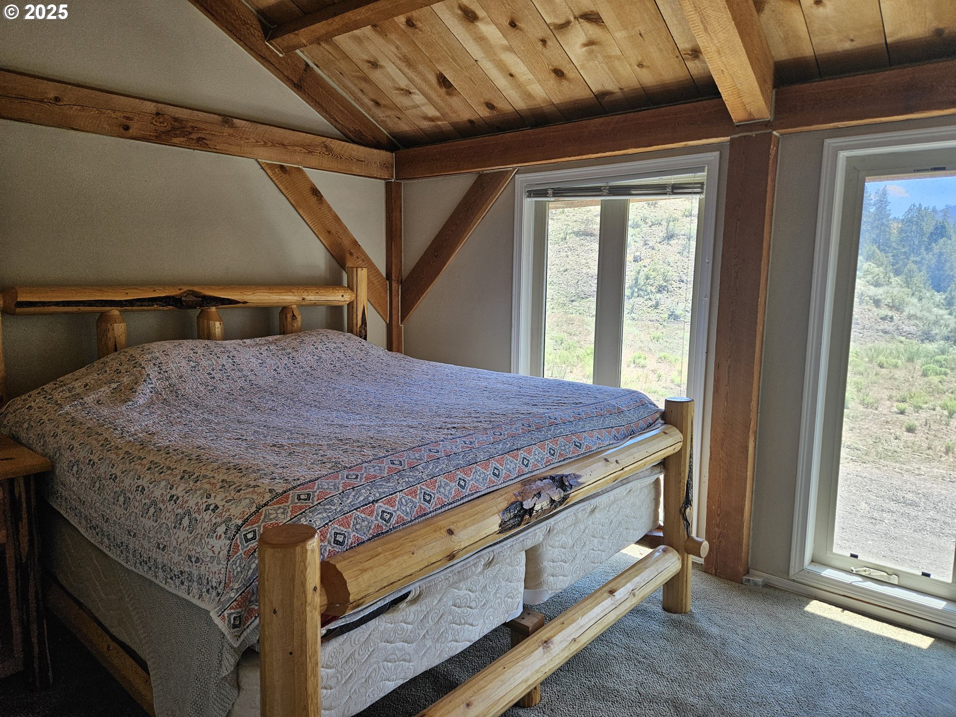 12142 Burns-Izee Road Seneca, OR 97873 - Photo 40 of 40 a bed sitting in a bedroom next to a window