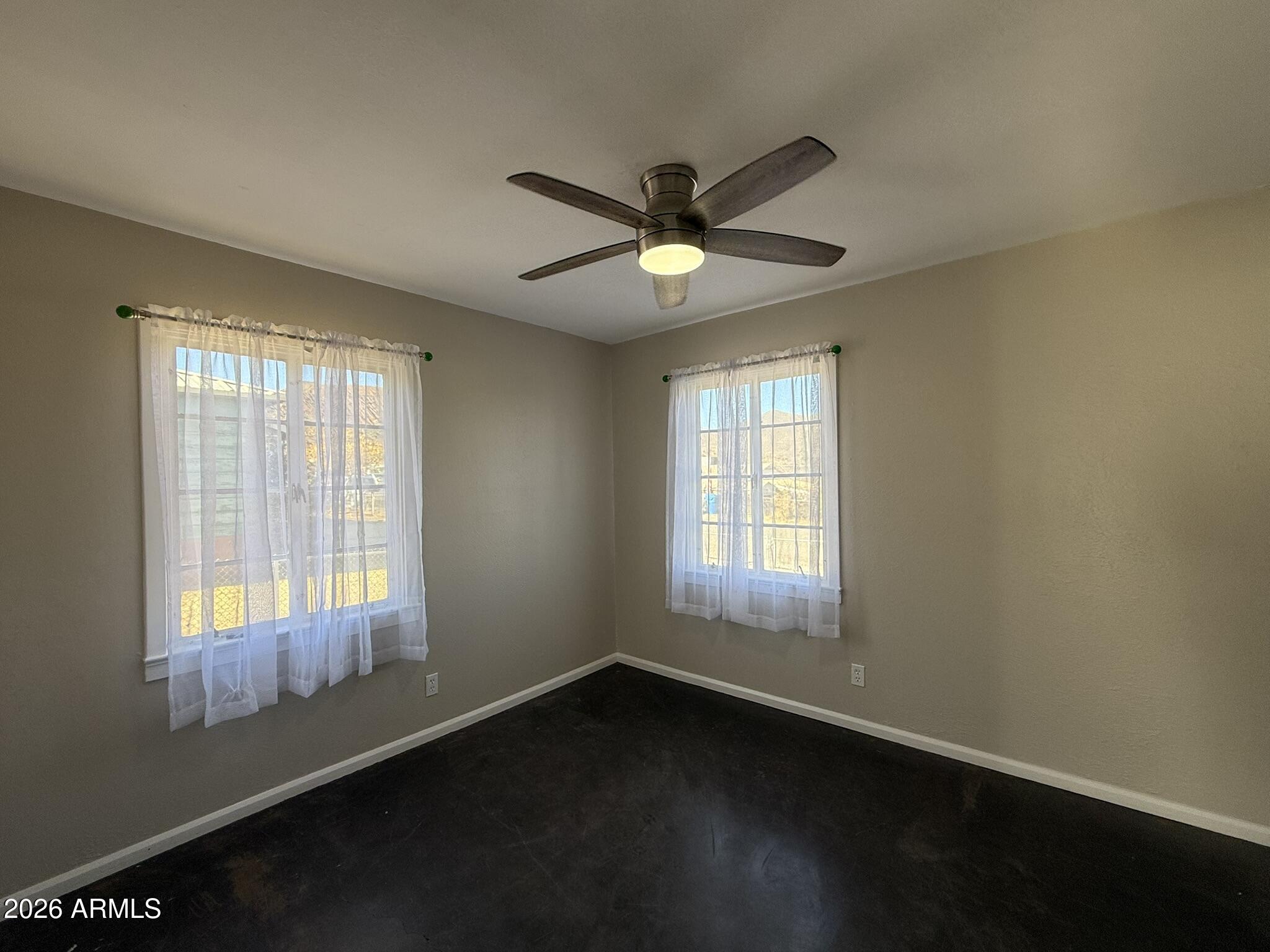 91 Neptune Avenue Bisbee, AZ 85603 - Photo 9 of 12 a view of an empty room with a window