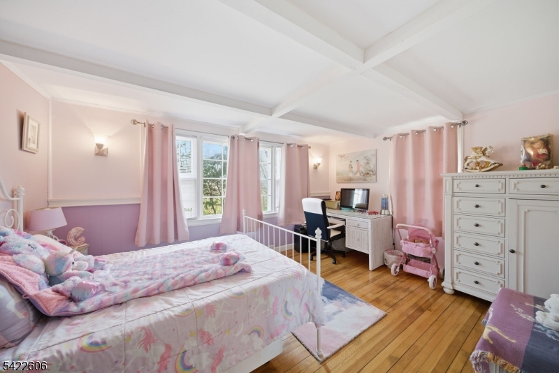 399 Springbrook Trail Sparta, NJ 07871 - Photo 15 of 27 a bedroom with a bed and wooden furniture