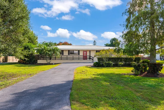 a view of a house with a swimming pool