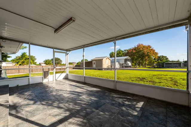 a view of a swimming pool with an outdoor seating