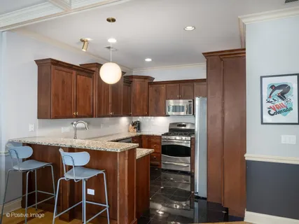 a kitchen with a sink cabinets and window