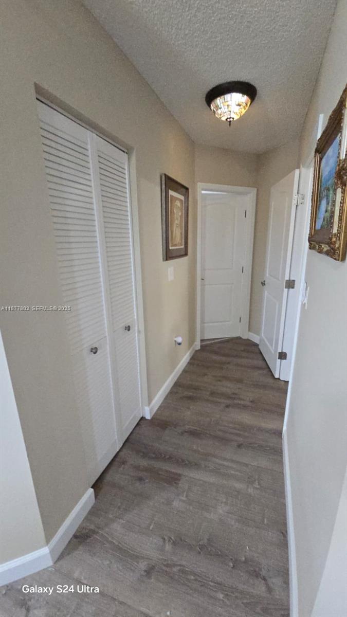15436 Southwest 151st Terrace Miami, FL 33196 - Photo 11 of 50 a view of a livingroom with wooden floor and stairs