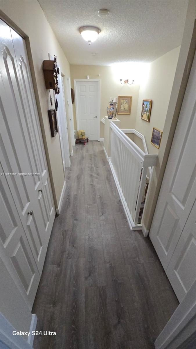 15436 Southwest 151st Terrace Miami, FL 33196 - Photo 12 of 50 a view of a hallway with wooden floor