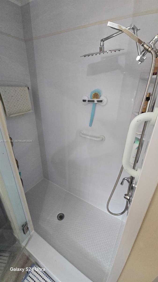 15436 Southwest 151st Terrace Miami, FL 33196 - Photo 22 of 50 a bathroom with a shower