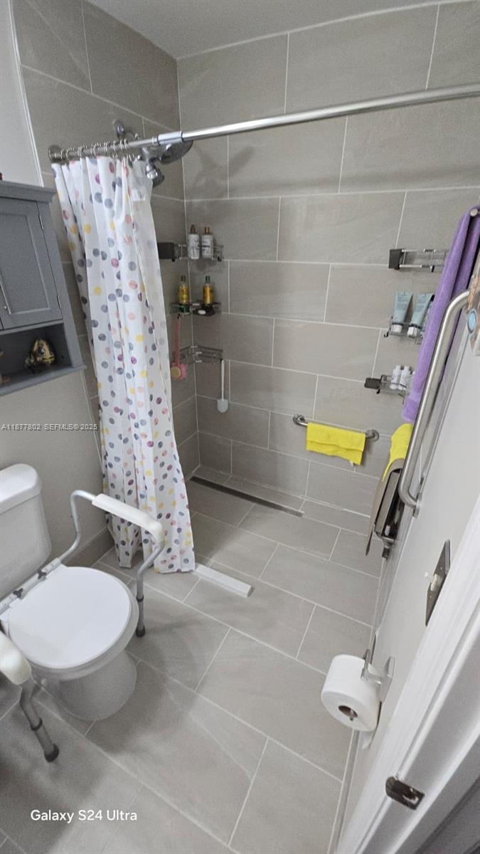 15436 Southwest 151st Terrace Miami, FL 33196 - Photo 27 of 50 a bathroom with a toilet and a shower