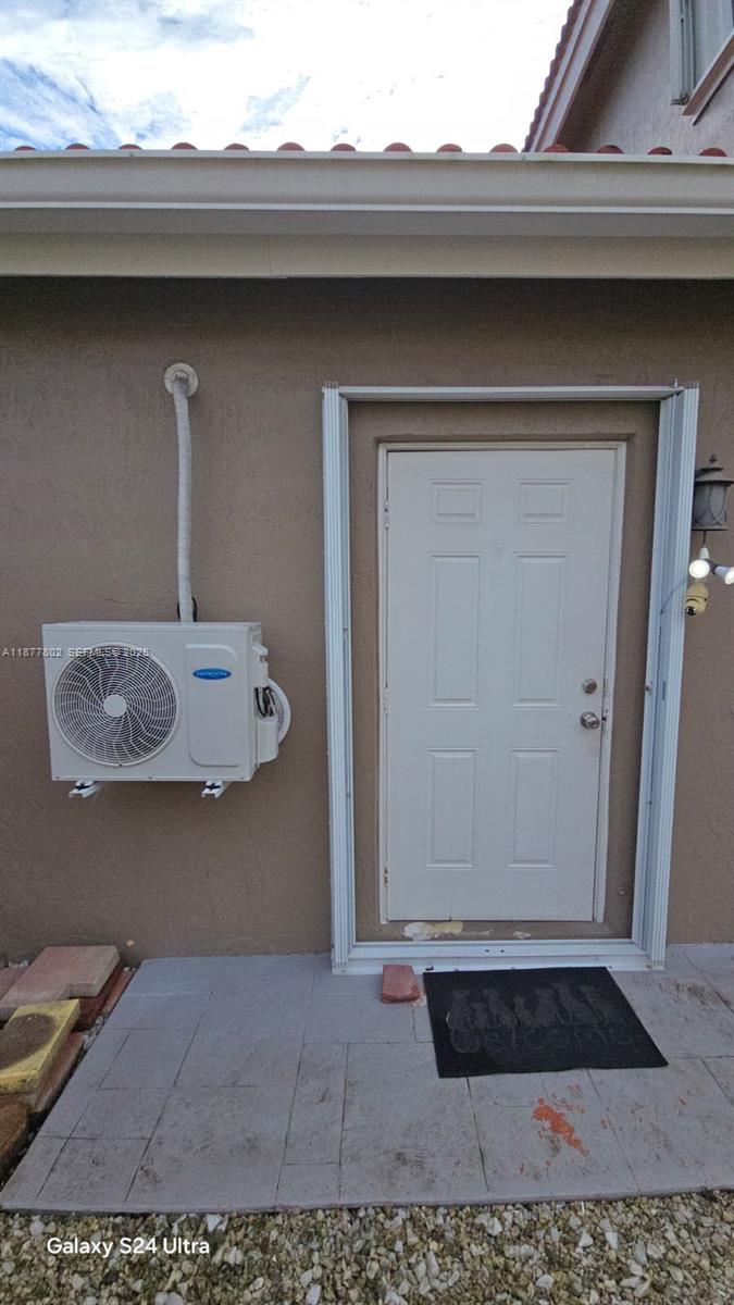 15436 Southwest 151st Terrace Miami, FL 33196 - Photo 36 of 50 a bathroom with a sink and a mirror